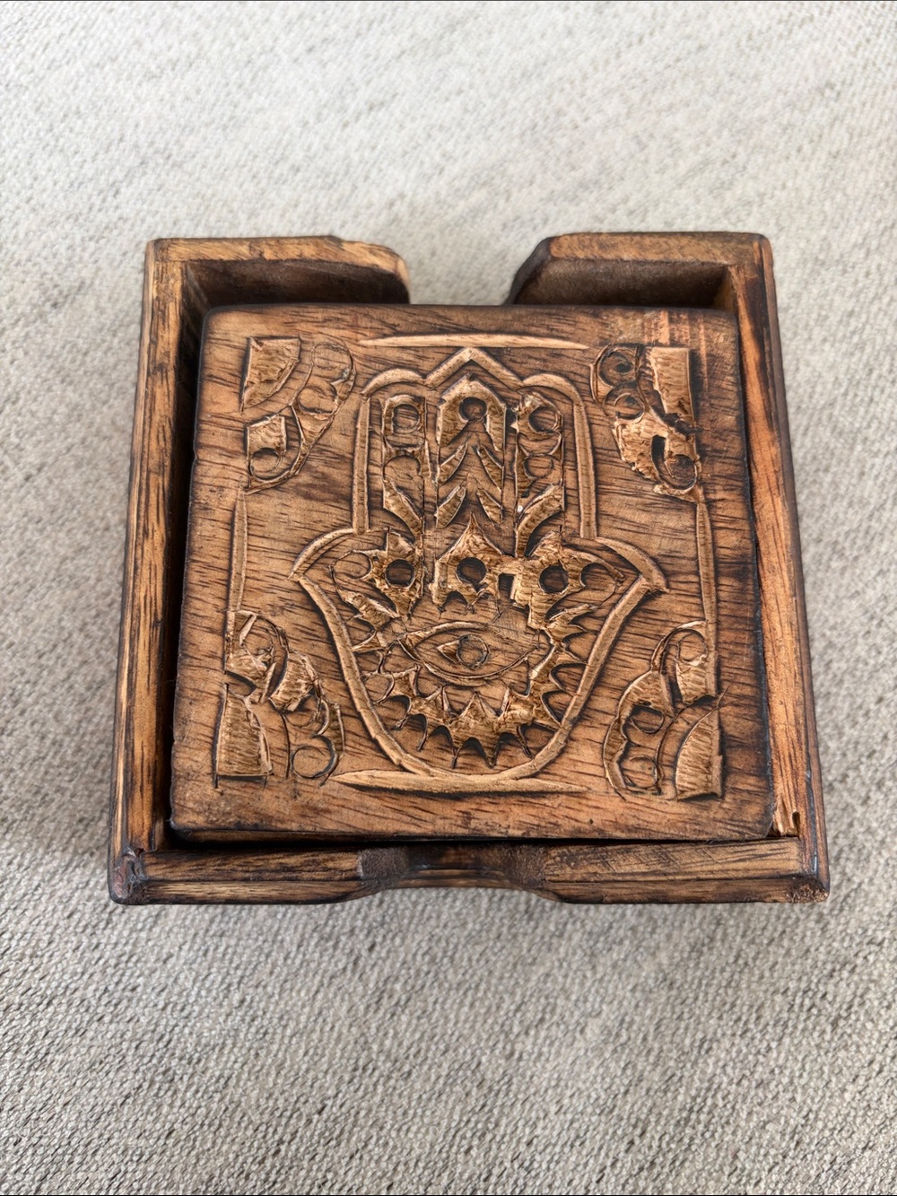 Hand-Carved Wooden coasters with Hamsa Carving - Brown
